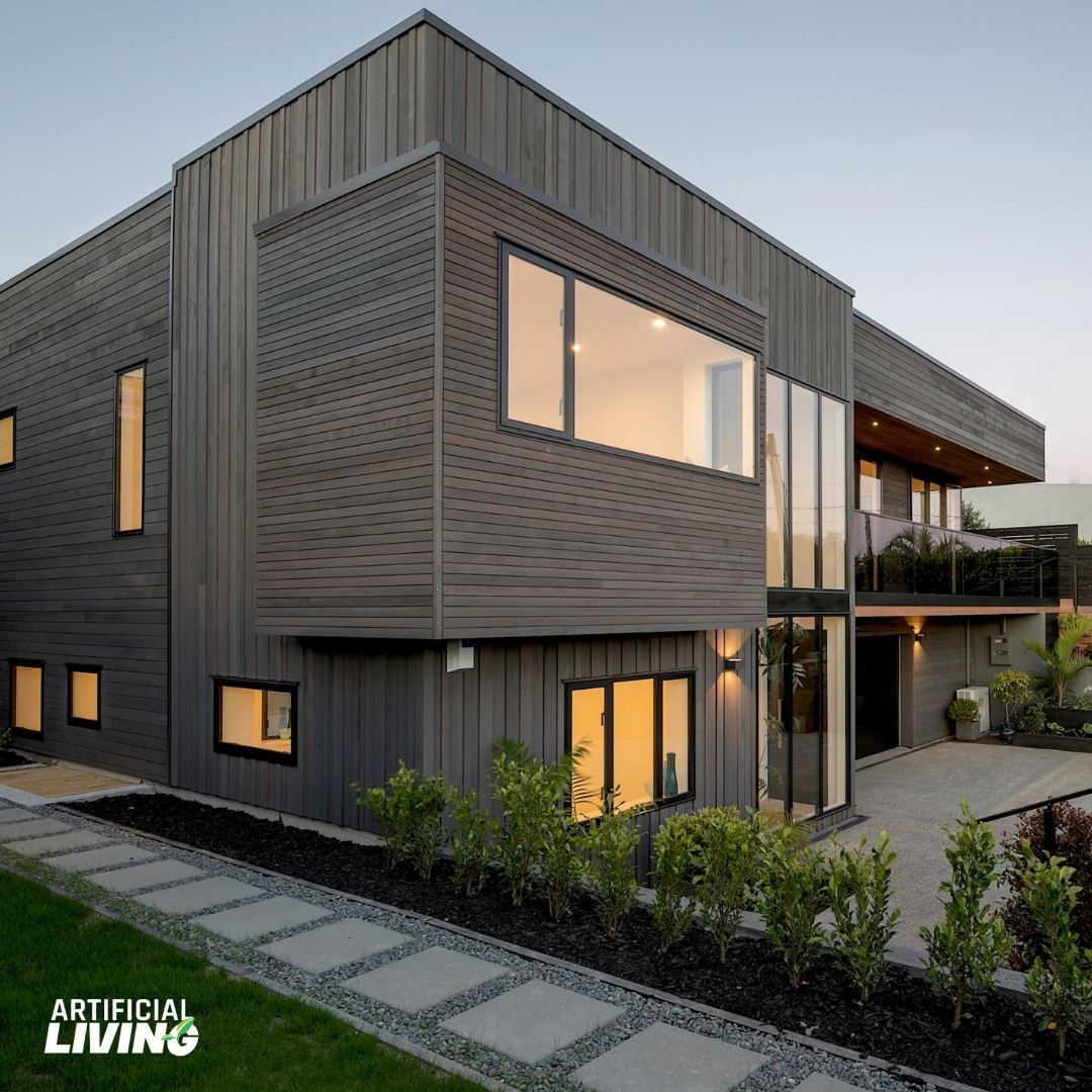 Modern house exterior finished with dark woodgrain cladding and large windows